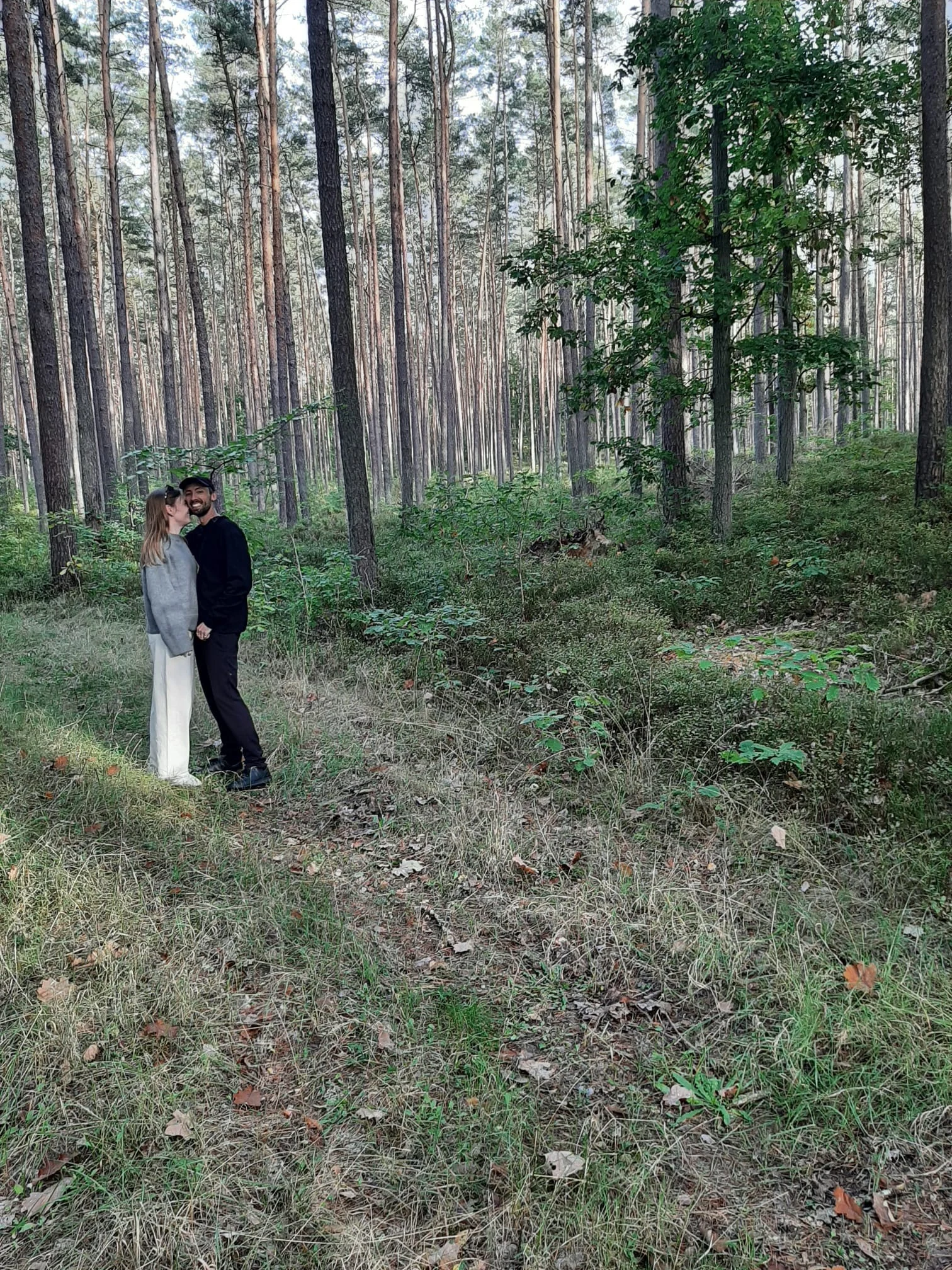 Paulina and Freddie together in the forest in black and white